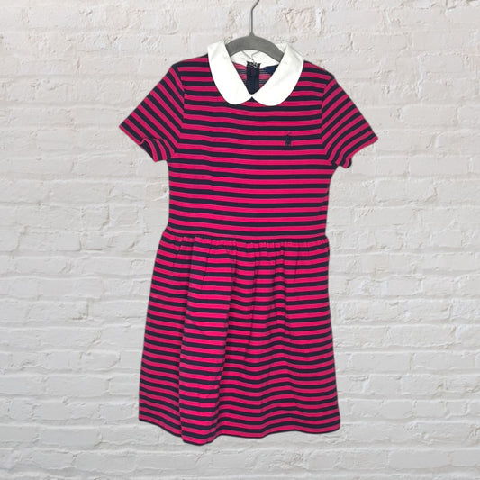 Pink and navy striped dress with short sleeves and a white Peter Pan collar, hanging on a hanger.