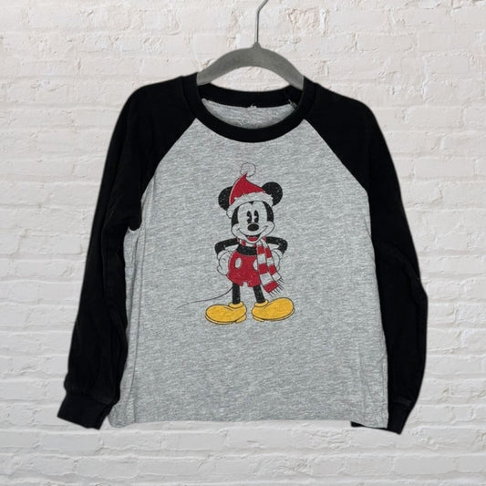 Gray and black long sleeve raglan shirt featuring Mickey Mouse dressed in holiday attire with a scarf and Santa hat.