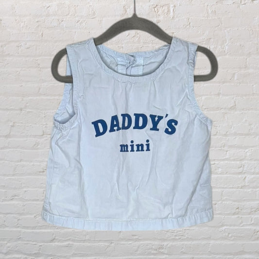 Light blue sleeveless top with 'Daddy's Mini' printed in navy text, hanging on a dark hanger.