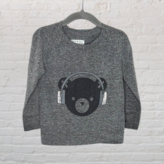 Gray sweatshirt for kids with a bear wearing headphones graphic, from Tuxbaby, displayed on a hanger.