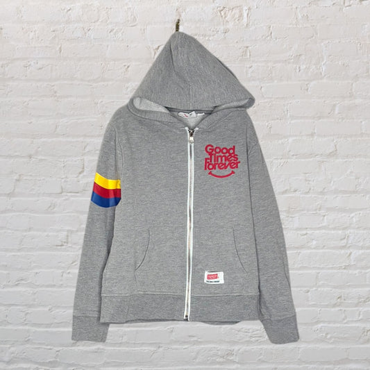 Grey zip-up hoodie with 'Good Times Forever' print and a colorful stripe on the sleeve.