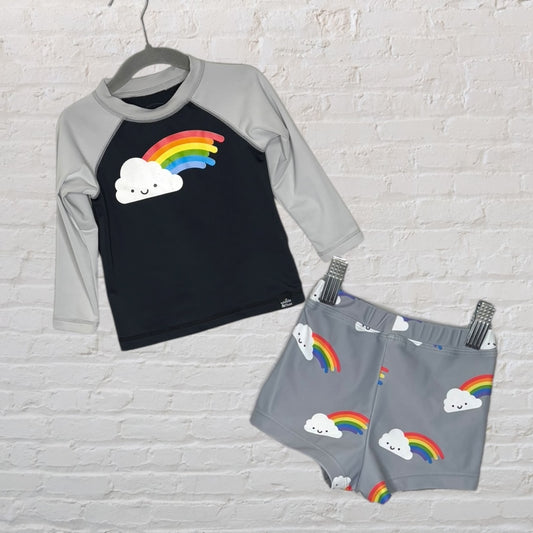 Unisex swim set featuring a black top with grey sleeves and rainbow cloud print, and grey shorts with matching pattern.