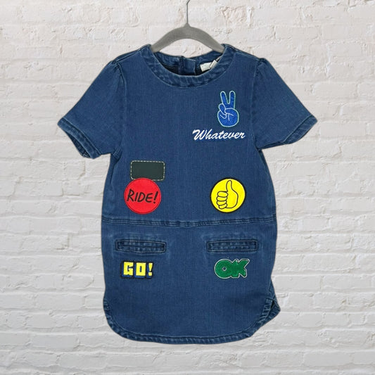 Denim dress with various colorful patches including peace sign, 'Whatever,' 'Ride!,' 'Go!,' and 'OK.'