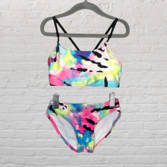 Vibrant multicolor tie-dye bikini set with black straps, top and bottom displayed on hangers.