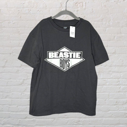 Black GAP T-shirt featuring a white Beastie Boys logo, new with tags, hanging on a gray clothes hanger.