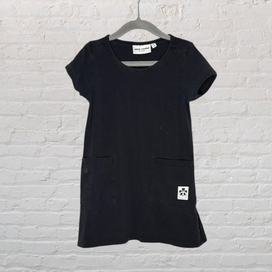 Black Mini Rodini dress with short sleeves and front pockets, featuring a small panda logo patch.