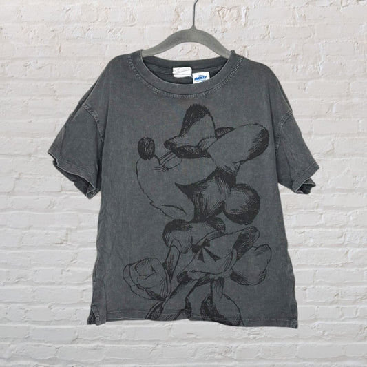 Disney Mickey Mouse faded black t-shirt with a large sketch-style graphic, hanging on a hanger.