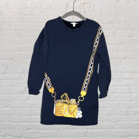 Navy long sleeve dress featuring a trompe-l'œil print of a gold purse with a chain strap.