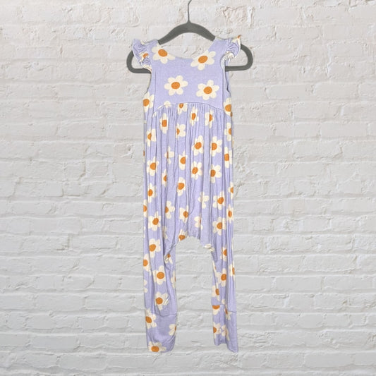 Lavender jumpsuit with white and yellow floral print and ruffle straps.