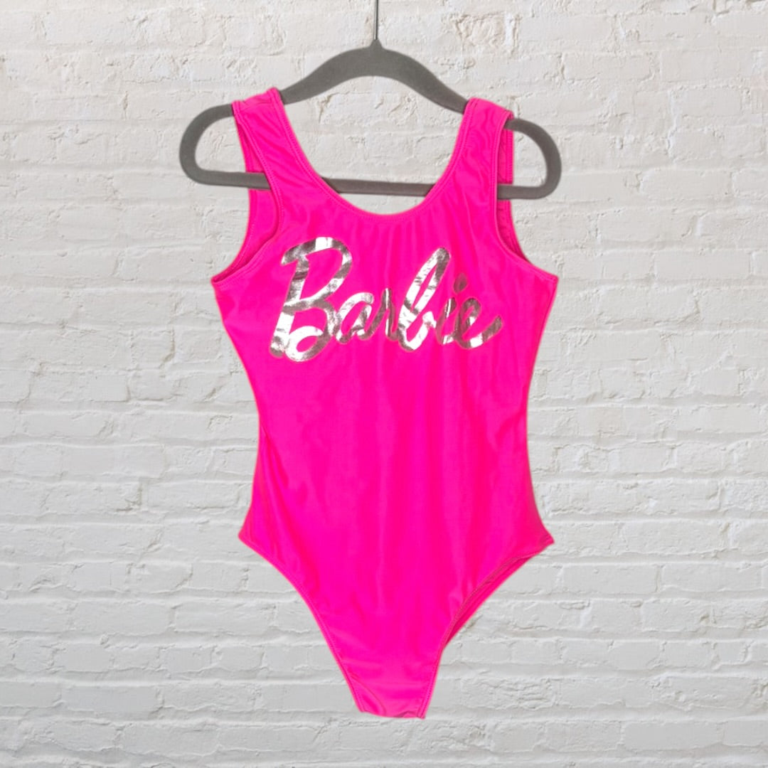 Neon pink bodysuit with silver 'Barbie' logo on the front, displayed on a hanger.