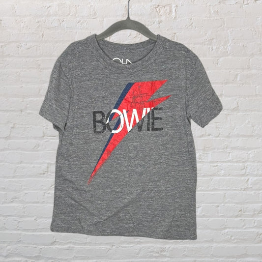 Grey T-shirt featuring David Bowie text with red and blue lightning bolt design, hung on a hanger.