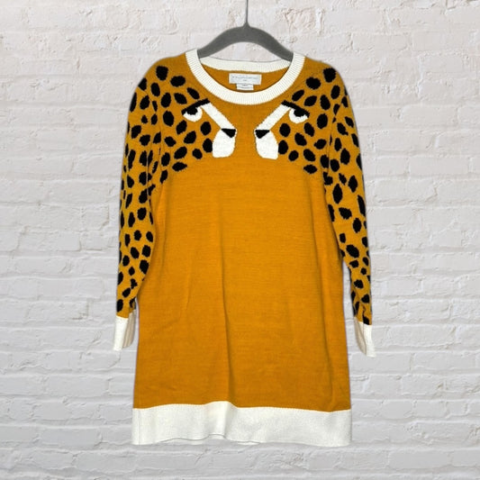 Mustard yellow sweater dress with black leopard print accents and contrasting white trim by Stella McCartney.