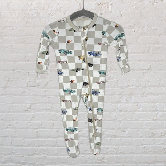 Unisex footed onesie with beige and grey checkered pattern and colorful car print hanging on a gray hanger.