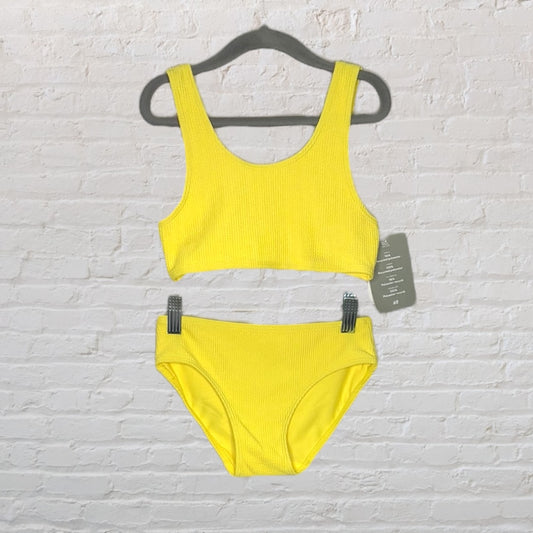 Bright yellow textured bikini set with tank-style top and matching bottoms, displayed on a hanger with tags.