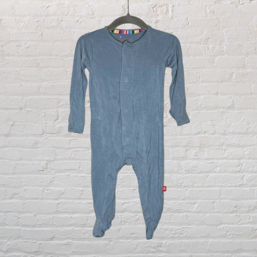 Blue baby footed sleeper with long sleeves displayed on a hanger.