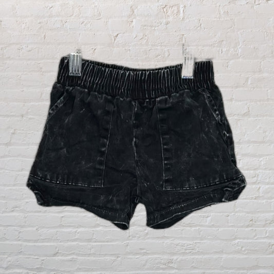 Black denim shorts with an elastic waist and pockets, displayed on clips.