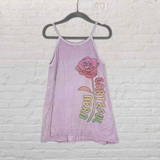 Lavender tank top with a red rose and 'Grateful Dead' graphic, hanging on a black hanger against a white wall.