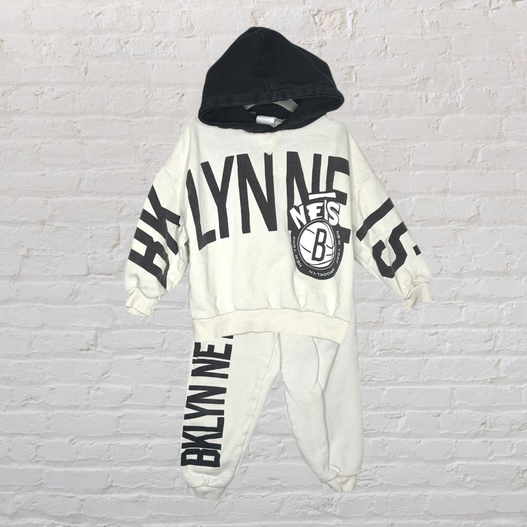White and black hoodie and sweatpants set with Brooklyn-themed graphic print.