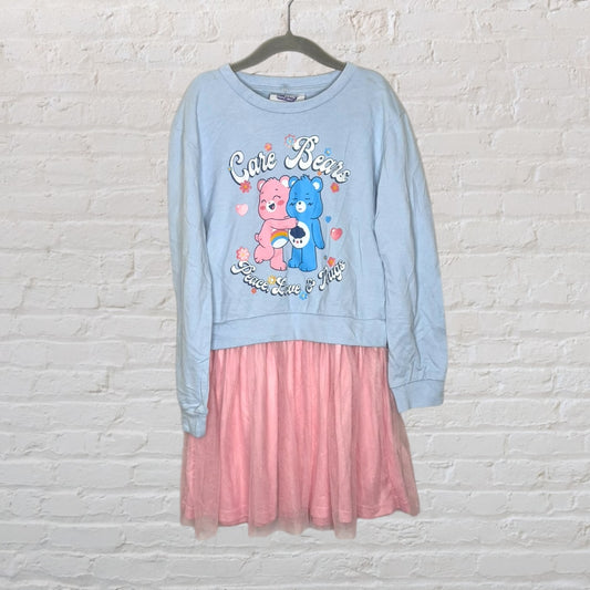 Blue long-sleeve dress with Care Bears print on top and pink tulle skirt.