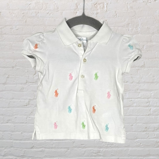 White short-sleeve polo shirt with multicoloured embroidered pony motifs, made by Ralph Lauren.