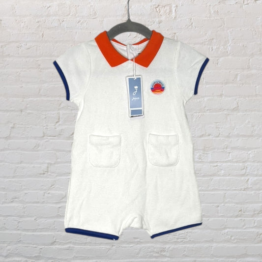 White romper with orange collar and blue trim, featuring a patch on the chest, displayed with original tags.
