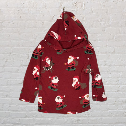 Red hoodie with a playful Santa Claus print featuring various holiday-themed motifs, suitable for festive wear.