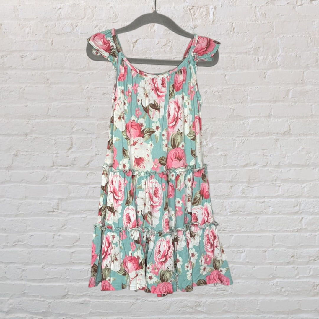 Mint green floral summer dress with pink and white flowers, featuring tie sleeves, hanging on a gray hanger.