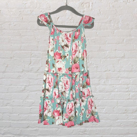 Mint green floral summer dress with pink and white flowers, featuring tie sleeves, hanging on a gray hanger.