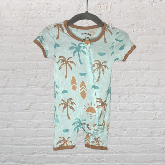 Light blue baby romper with brown tropical print and contrasting trims, hanging on a black hanger.
