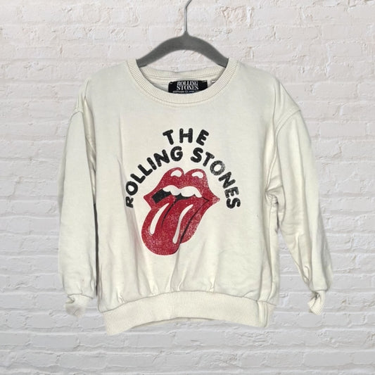 White sweatshirt featuring The Rolling Stones iconic tongue and lips logo in red, with black text above.