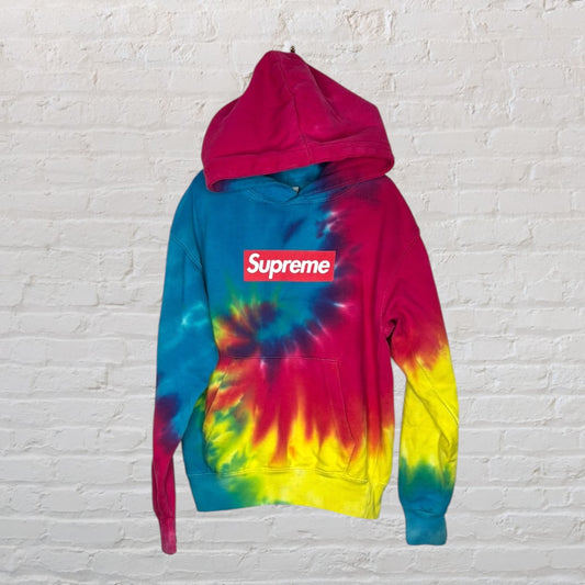 Supreme tie-dye hoodie with a red, blue, and yellow pattern, featuring the classic box logo on the front.