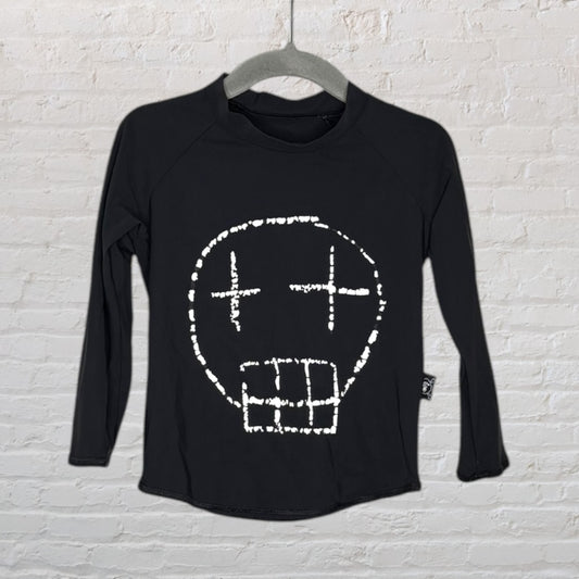 Black long sleeve t-shirt featuring a white abstract skull design on the front, hanging on a hanger.