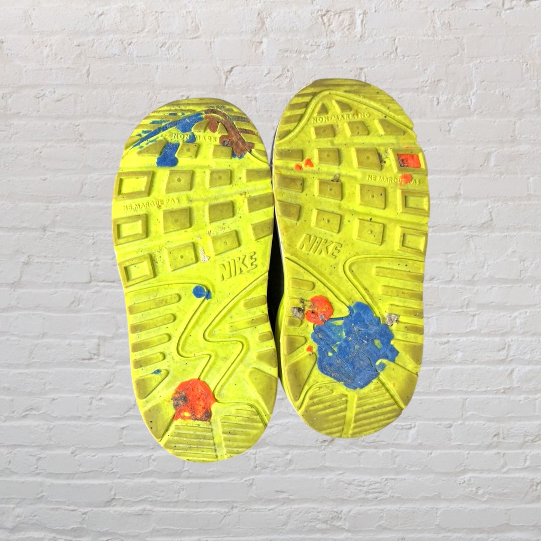 Nike Air Max kids' sneakers in gray, pink, and yellow with blue laces.