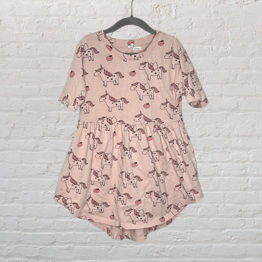 Pink children's dress with unicorn and apple pattern, by Cat & Jack, hanging on a hanger.