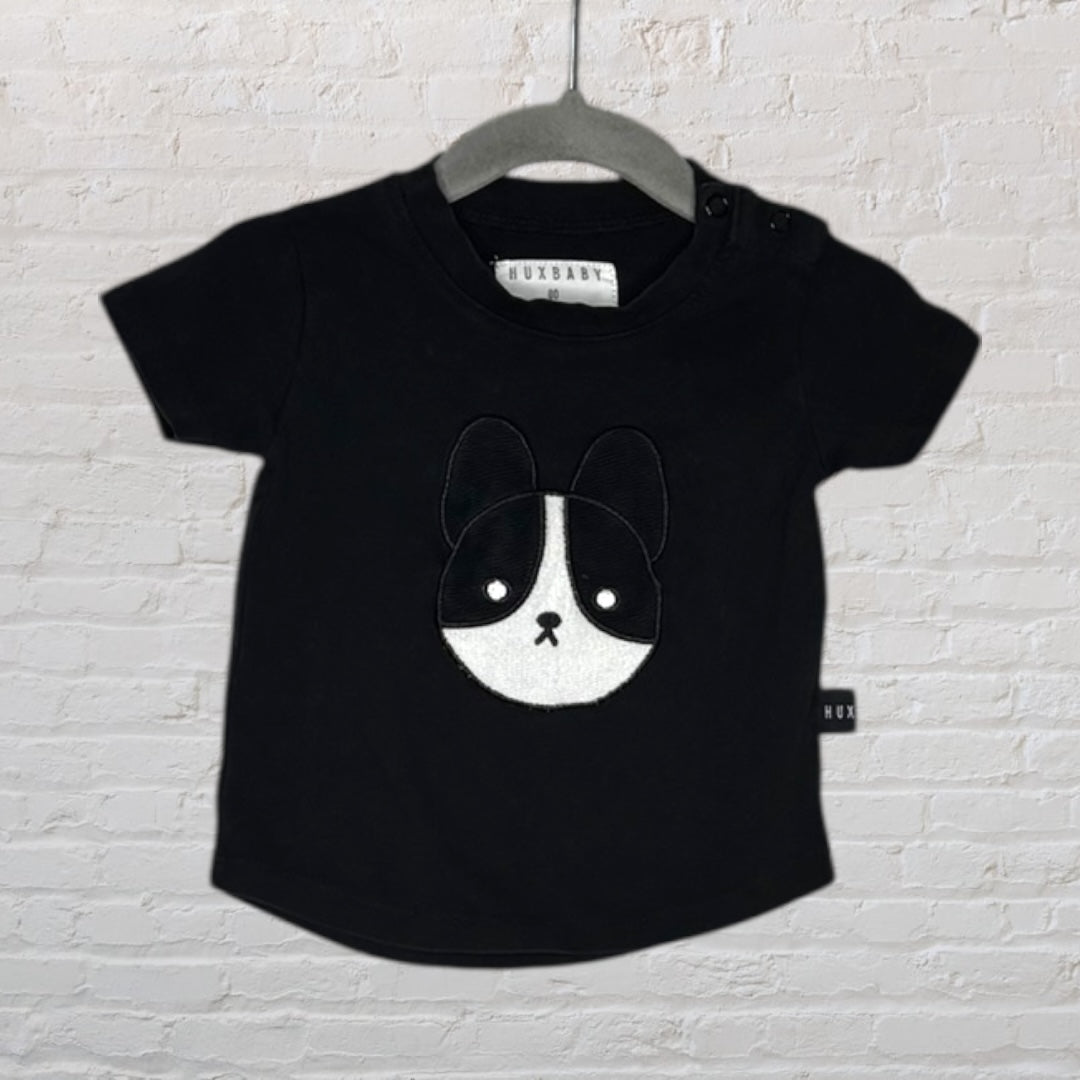 Black Huxbaby short-sleeve T-shirt for kids featuring a cute puppy face applique on the front.