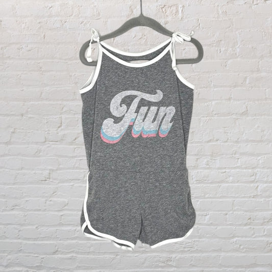 Gray romper with 'Fun' graphic and white trim hanging on a hanger.