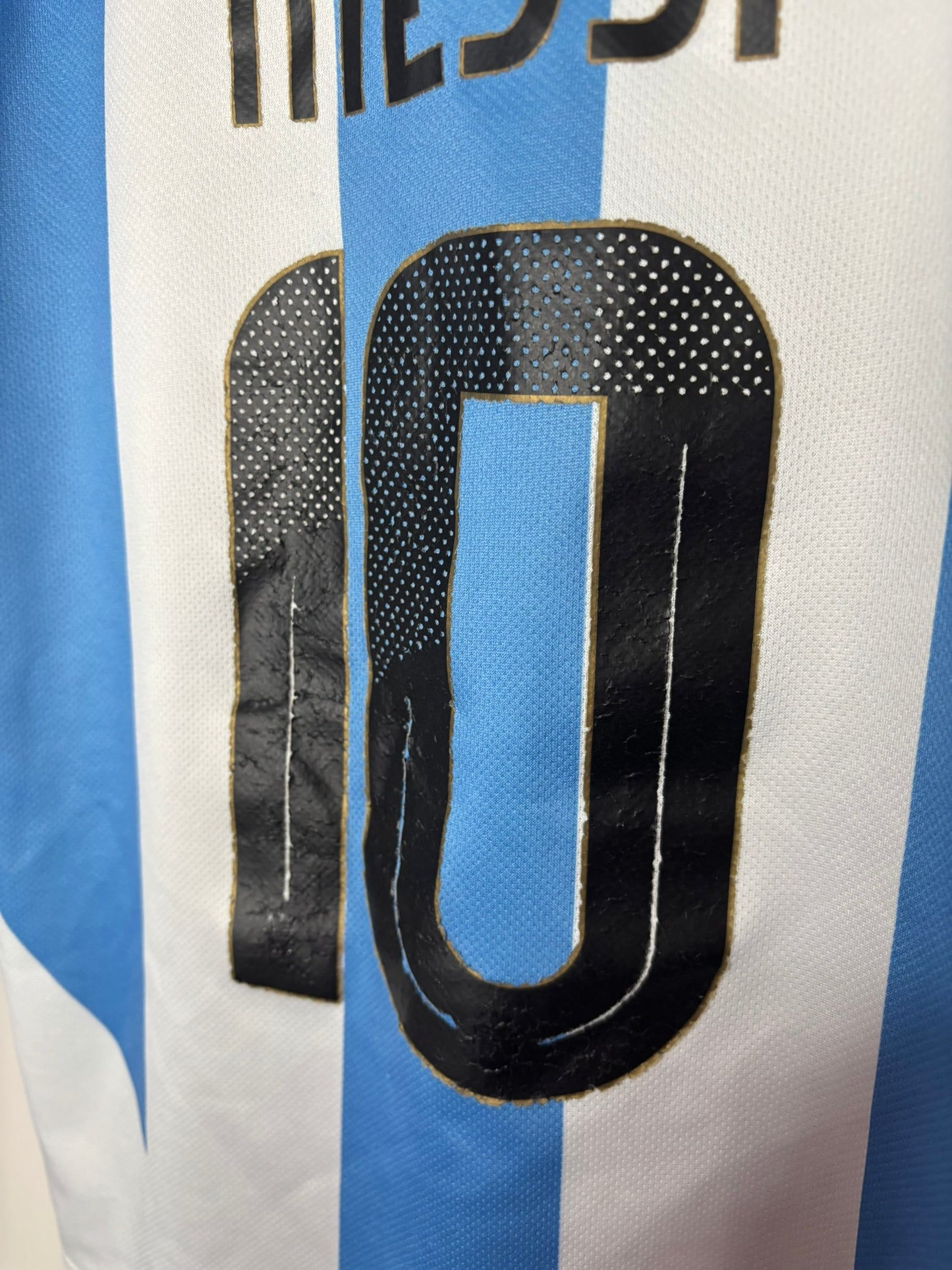 Argentina national team soccer kit with blue and white stripes, featuring number 10 and AFA crest.