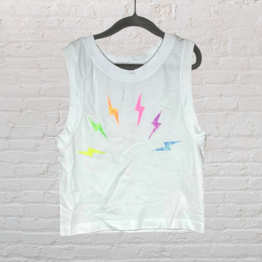 White tank top with colorful lightning bolt graphics and sleeveless design on a black hanger.