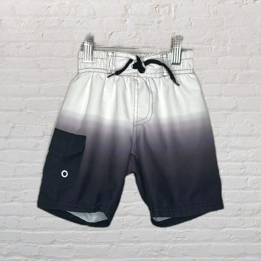 Men's swim trunks with a white to black gradient, featuring a pocket, drawstring closure, and elastic waistband.