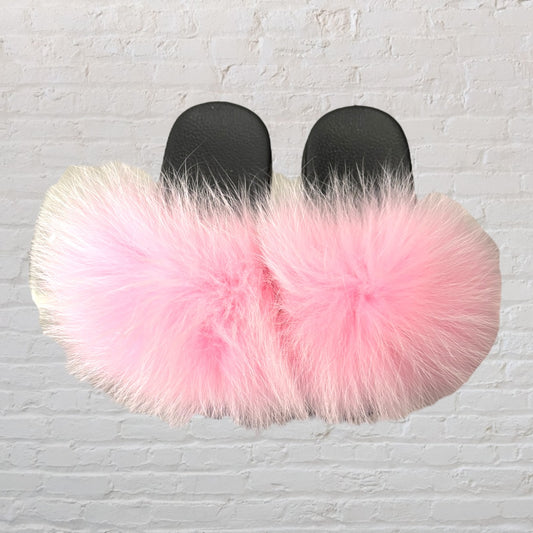Women's black slide sandals featuring fluffy pink fur on the upper strap.
