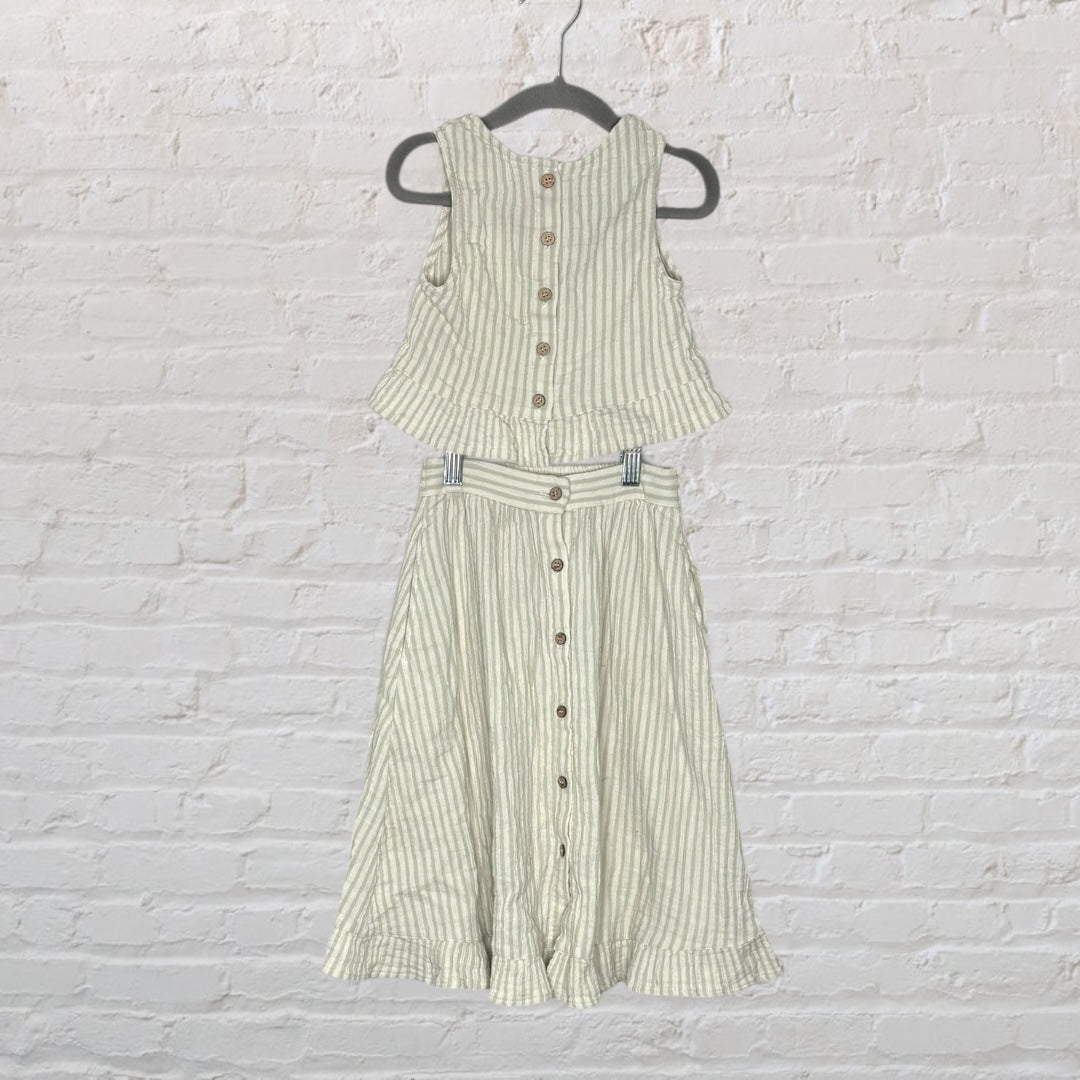 Women's two-piece outfit with cream and beige stripes, featuring a sleeveless button-down top and a matching long skirt with ruffled hem.
