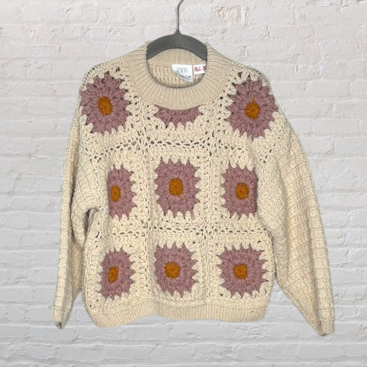 Zara cream sweater with crochet floral design in pink and orange on a hanger.