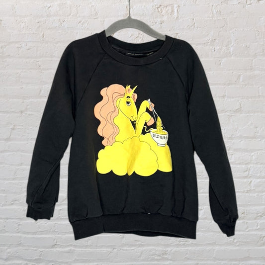 Black sweatshirt with a colorful unicorn graphic eating noodles, featuring bright yellow and pink tones.