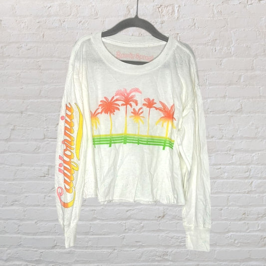 White long sleeve shirt with colorful palm trees and 'California' text, featuring a relaxed fit.