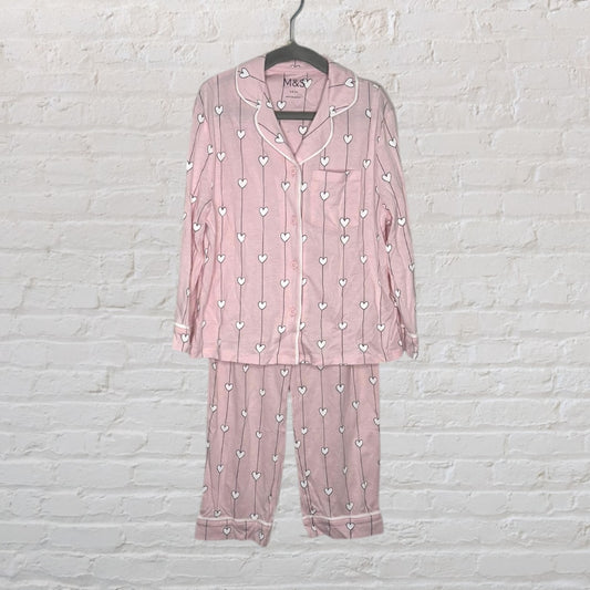 Pink pajama set with white heart patterns, featuring long sleeves and button-up top from M&S.