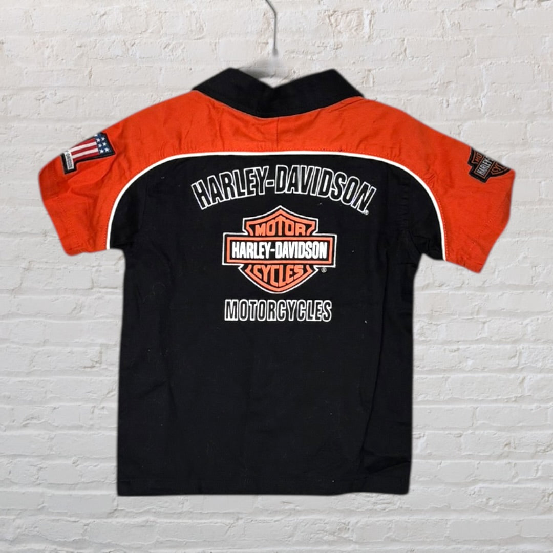 Black and orange Harley-Davidson shirt with embroidered logos and graphics, featuring short sleeves.