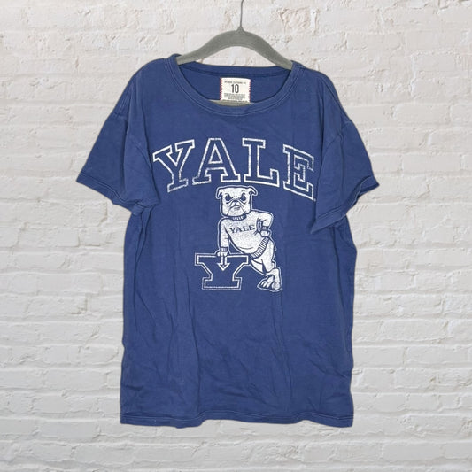 Blue Yale University T-shirt featuring a bulldog graphic and large 'Yale' text, hung on a hanger.