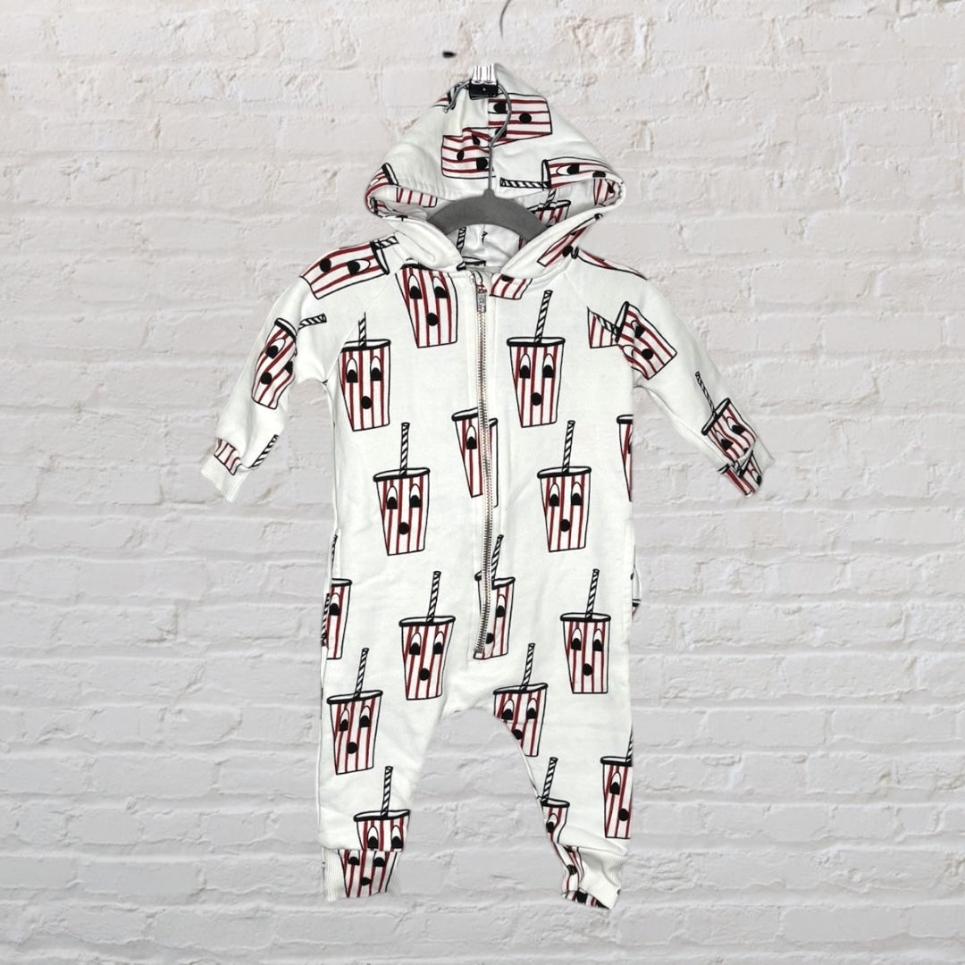 White hooded baby sleepsuit with cartoon drink print and front zipper.