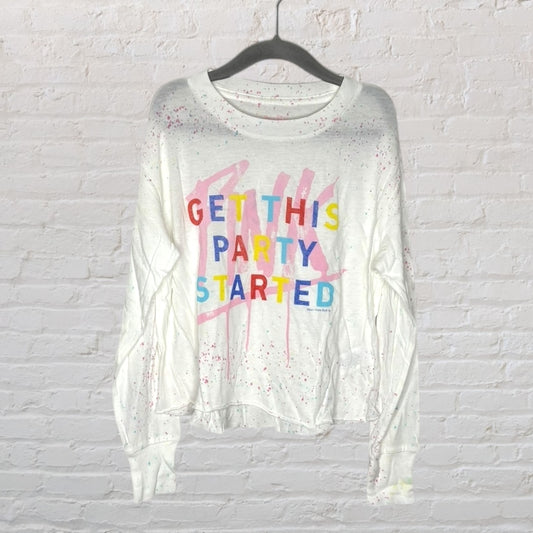 White sweatshirt with colorful text 'Get This Party Started' and paint splatter design hanging on a black hanger.