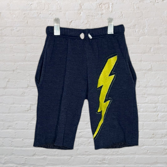 Navy blue shorts featuring a bold yellow lightning bolt design on the side.